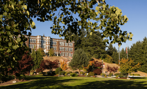 Saint Martin's campus, Old Main on the hill surrounded by trees