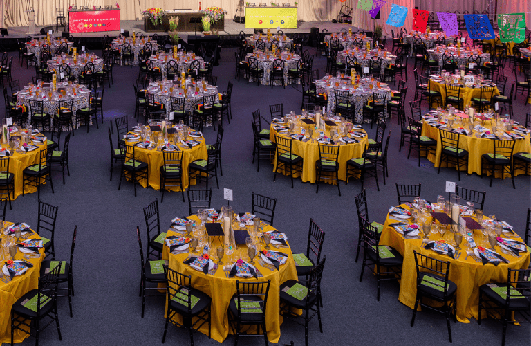 Rows of brightly set round tables