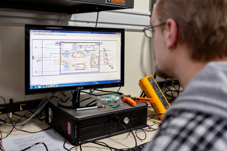 Mechanical engineering student working on a computer.
