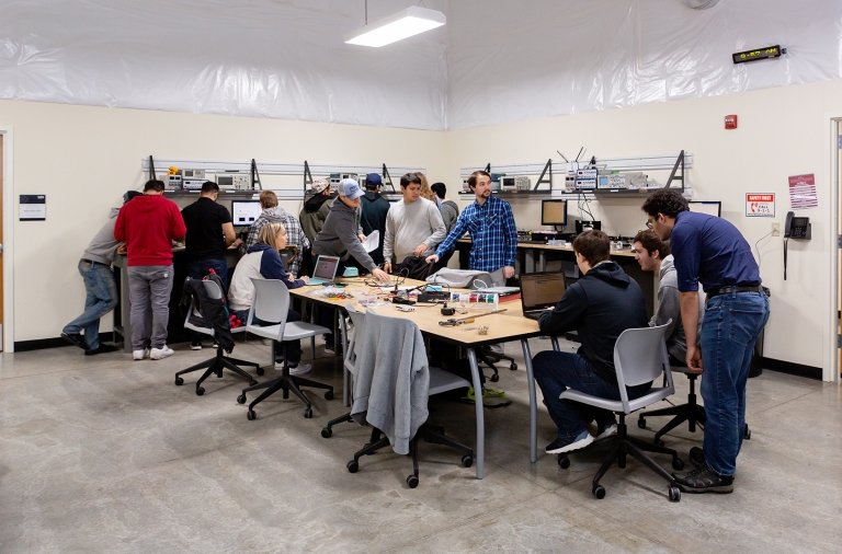 Mechanical engineering students working on a robotics class project.