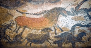 Ancient cave painting of running animals