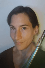 Photo of Lesley O'Donel, holding her flute