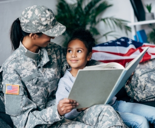 Military woman reading to child