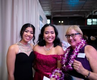 Photo of students with president's wife during gala