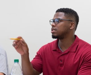 Photo of student asking question