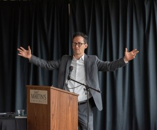 Photo of speaker during lecture