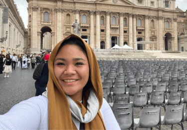 Student in front of ancient Roman building