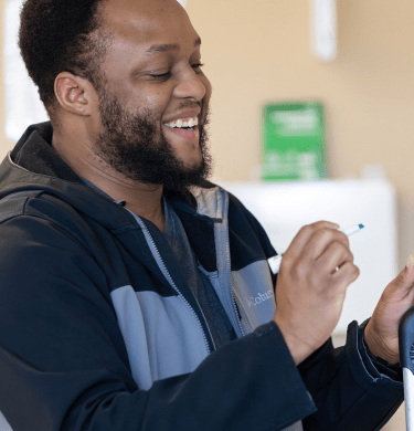 A student works on a whiteboard