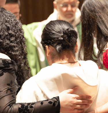 Students and monks stand in a circle