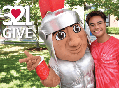 3.21GIVE 2023 3.21GIVE Marty posing with a student