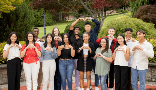 ASSMU leadership team 23-24 pose outside