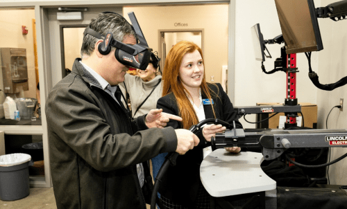 Two people work with equipment