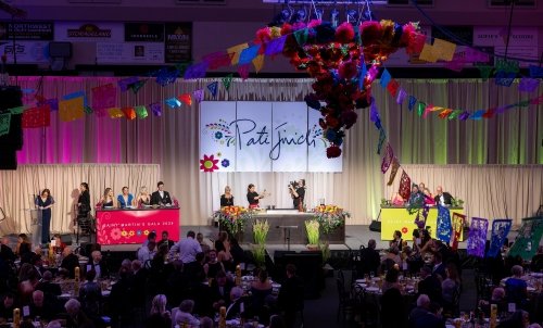 Chef Pati demonstrates on a colorful stage in front of an audience at Gala