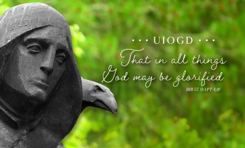 St. Benedict statue with a Benedictine motto overlaid on greenery