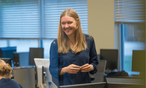 Andrea Kunder in a classroom with computers