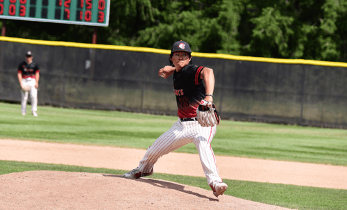 A Saints baseball player prepares to pitch