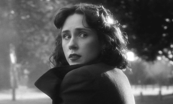 Black and white dramatic shot of a woman's face outside