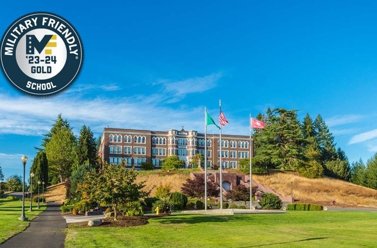 Military Friendly Designation 23-24 Old Main at the top of the hill on a sunny day, with the Military Friendly School 23-24 Gold badge in the top left corner