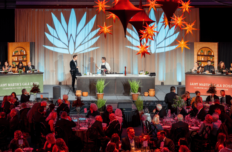 Chef Rick Bayless on stage in front of a crowd of people