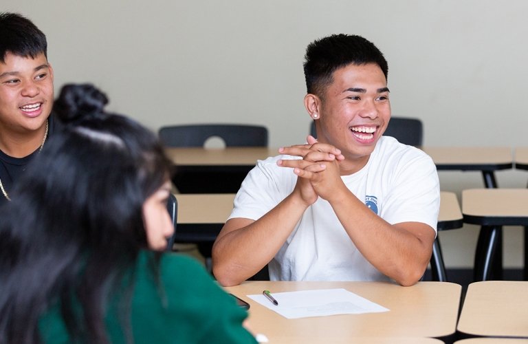 Photo of students in classroom laughing