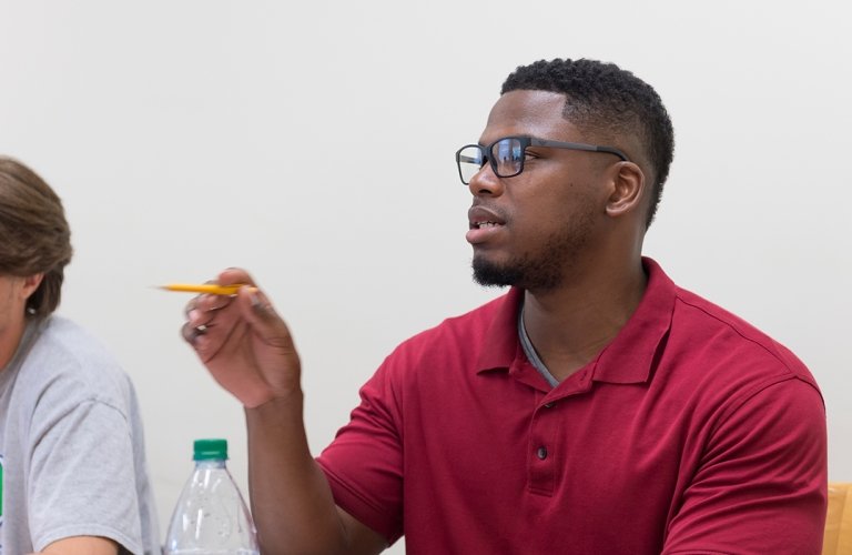 Photo of student asking question