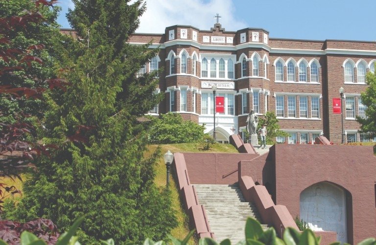 Old Main and green trees