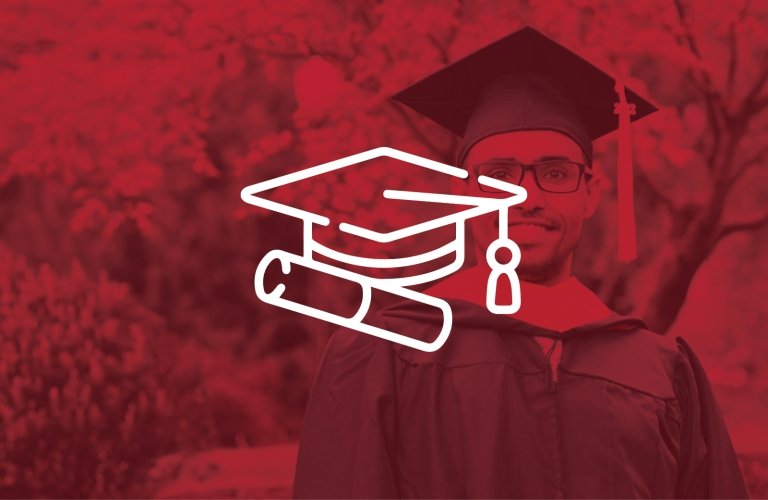 A white graduation cap and diploma in front an SMU-red shaded picture of a graduate in cap and gown