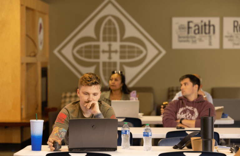 Students work in rows at computers