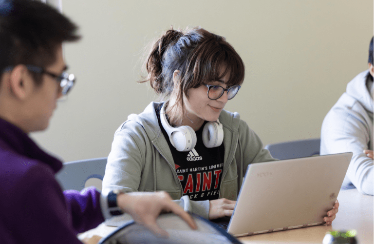 A student works on her laptop in class