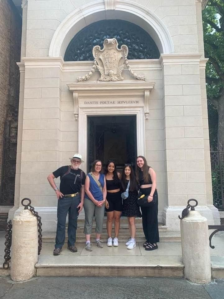Students and faculty in front of Dante's tomb in Italy