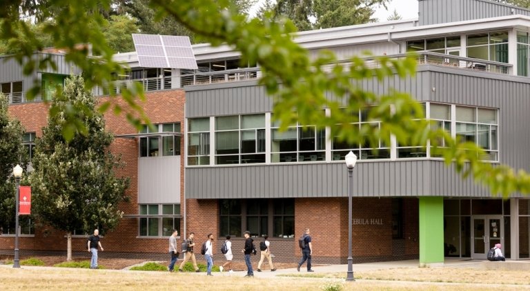 Students walk by Cebula Hall