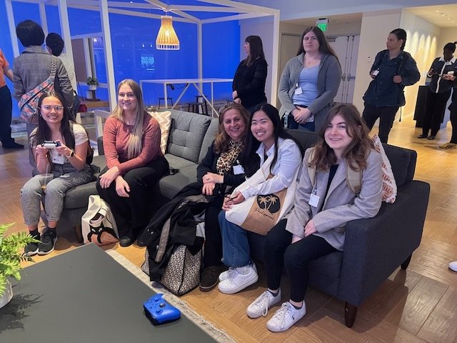 Students sit on a couch in a Microsoft lounge