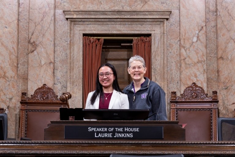 Photo of student with Washington government official