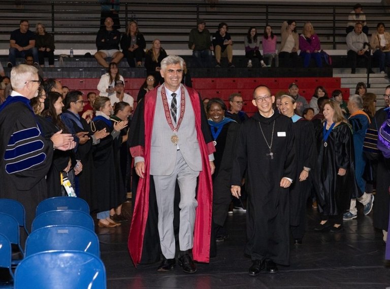 President Brownsberger and the abbot walk through a ceremony in regalia
