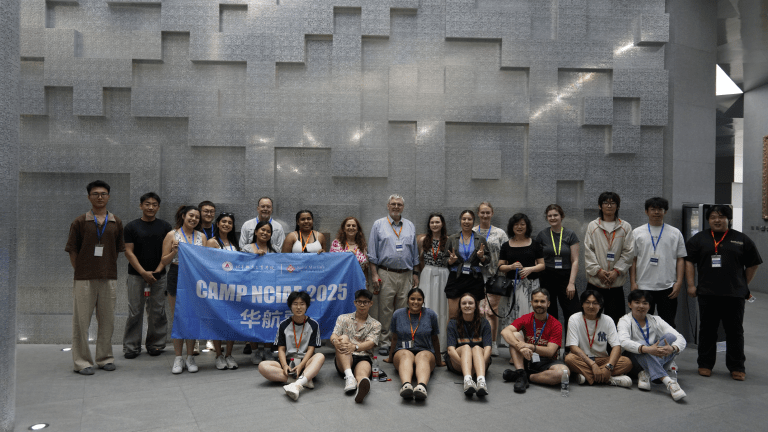 Students and staff with a group of students from partner university