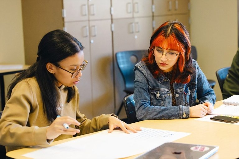 Students work together at a table
