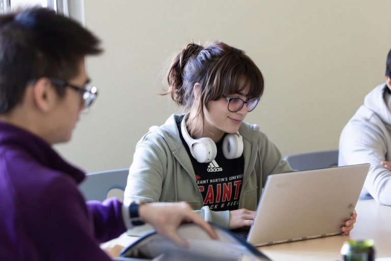 A student works on her laptop