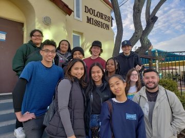 Saint Martin's students pose outside of the Dolores Mission during their spring break immersion trip in 2023