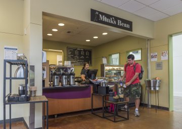 A student browses at the Monk's Bean coffee shop